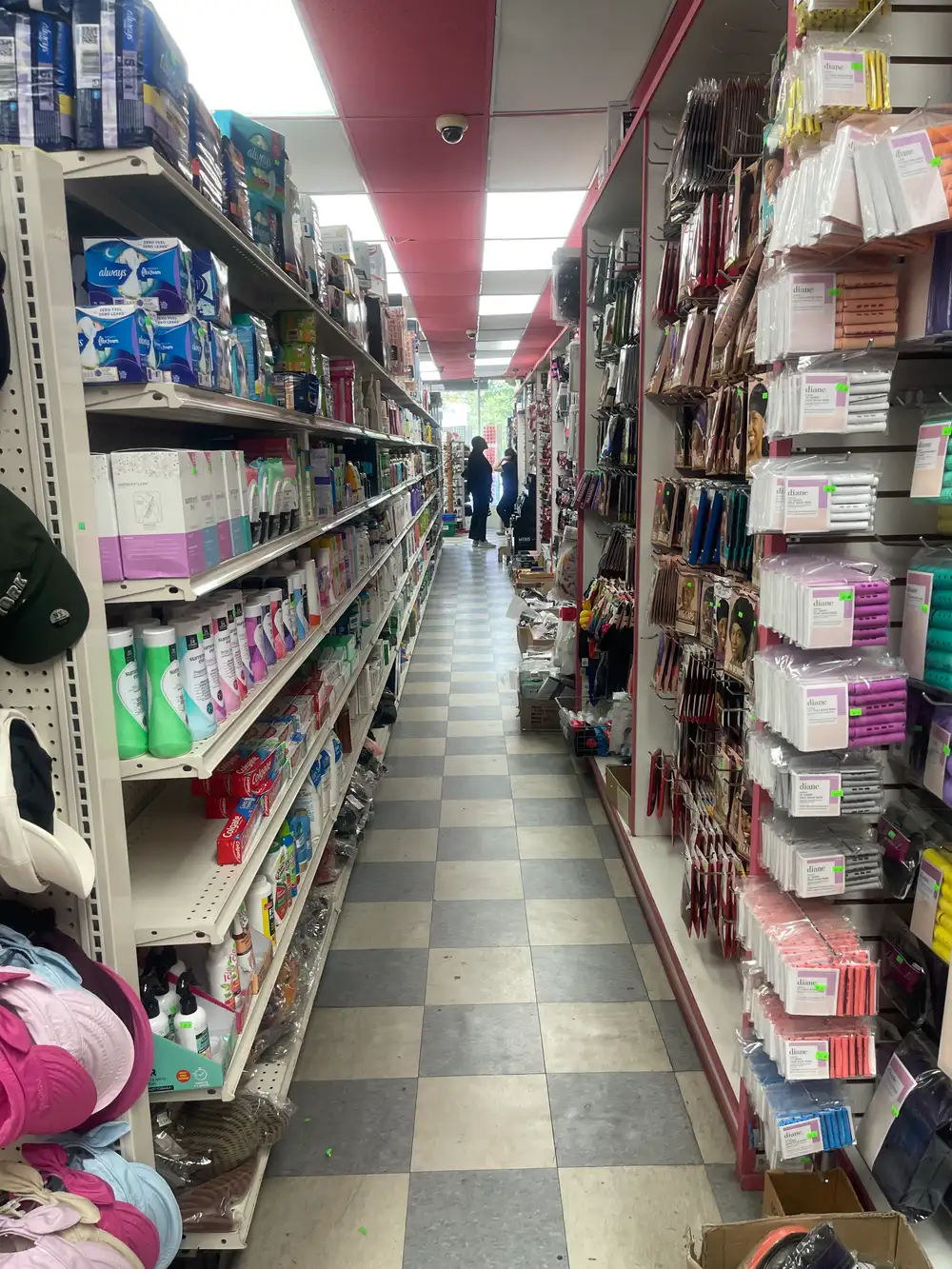 Hair rollers, combs, and accessories aisle at Honey Beauty Supply